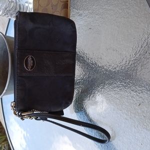 Coach small bag for wrist fits a few things and it's black and like new